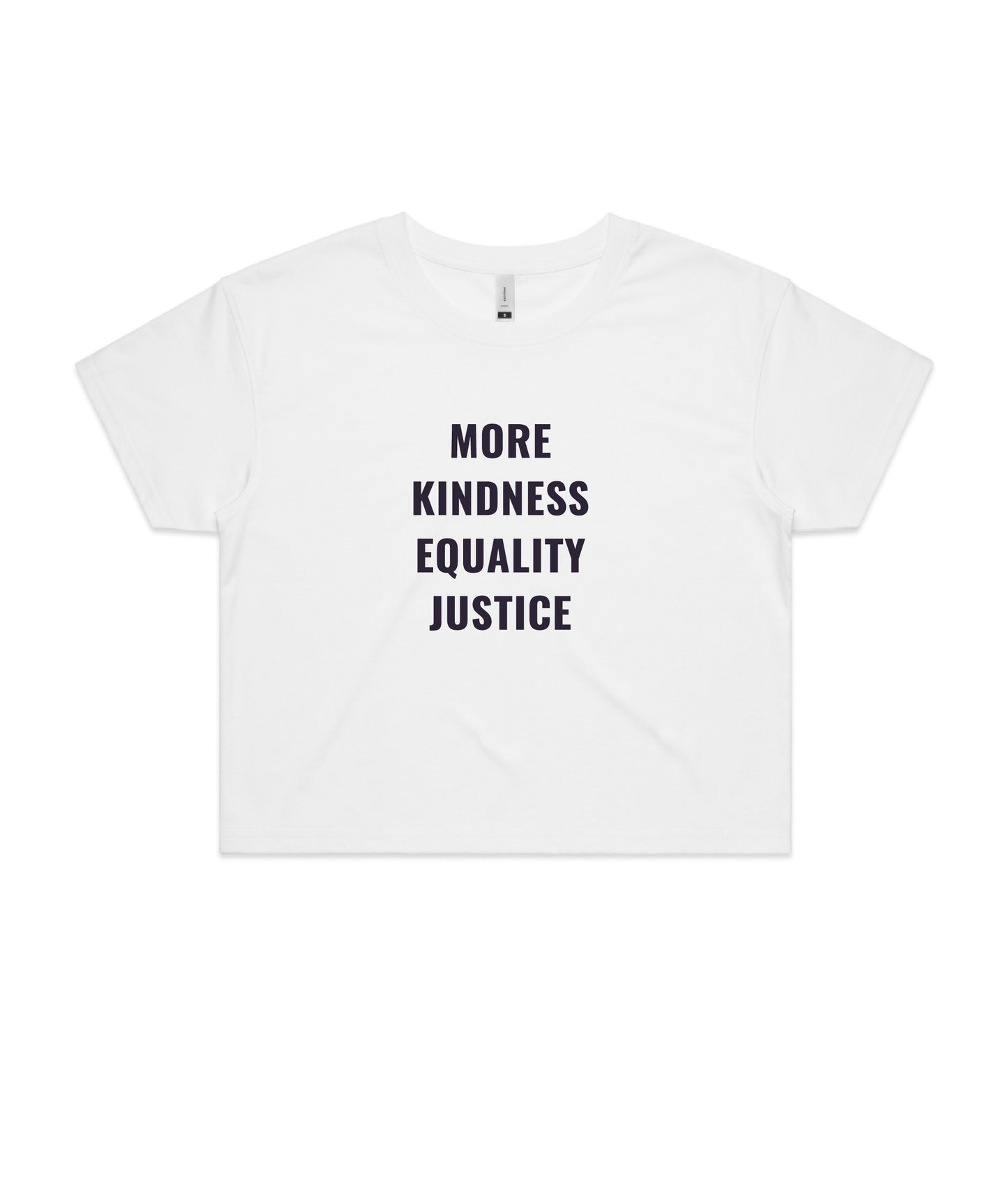 Flat lay of front of white crop top that reads 'More Kindness Equality Justice' in ink navy lettering on the front